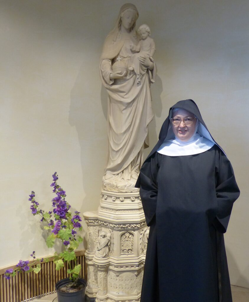 SrTherese by the statue of Our Lady of Consolation